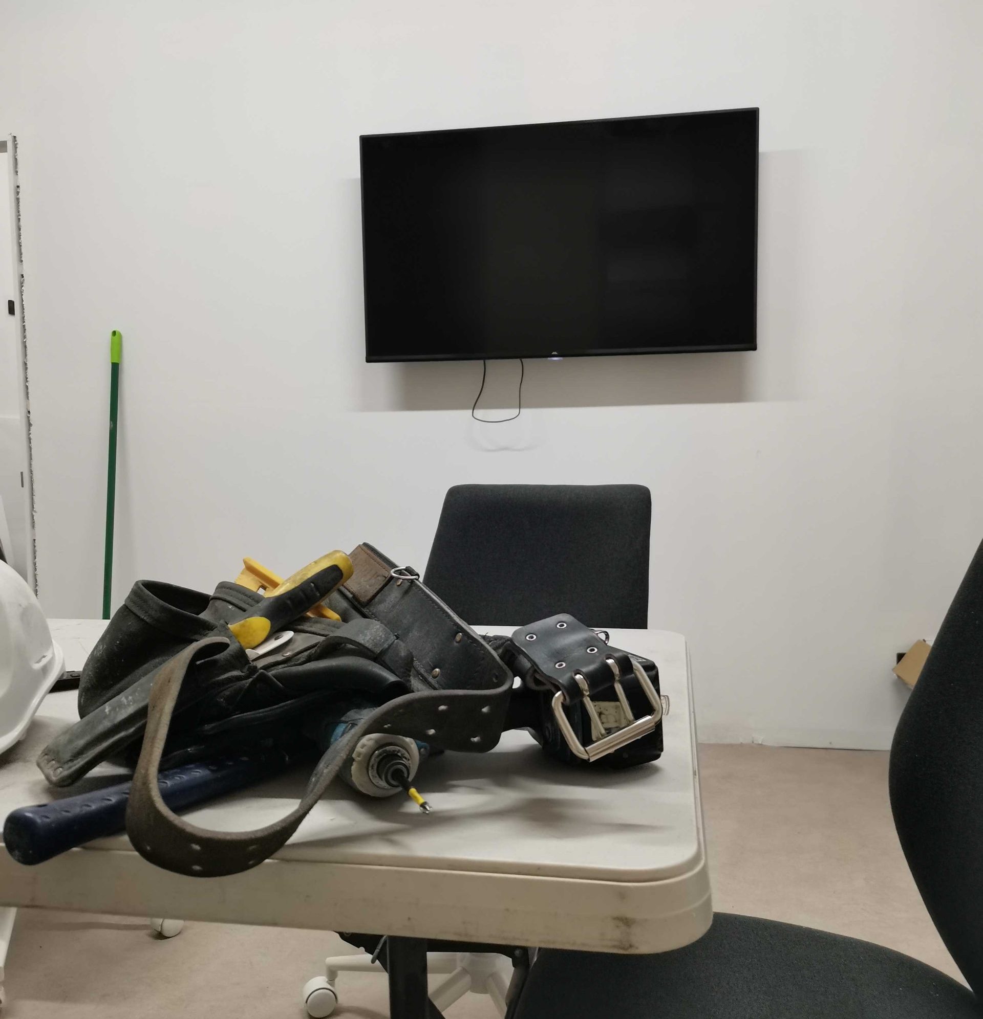TV mounted on wall of the office