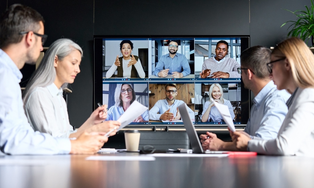 Hybrid board meeting with teams from office and remote members