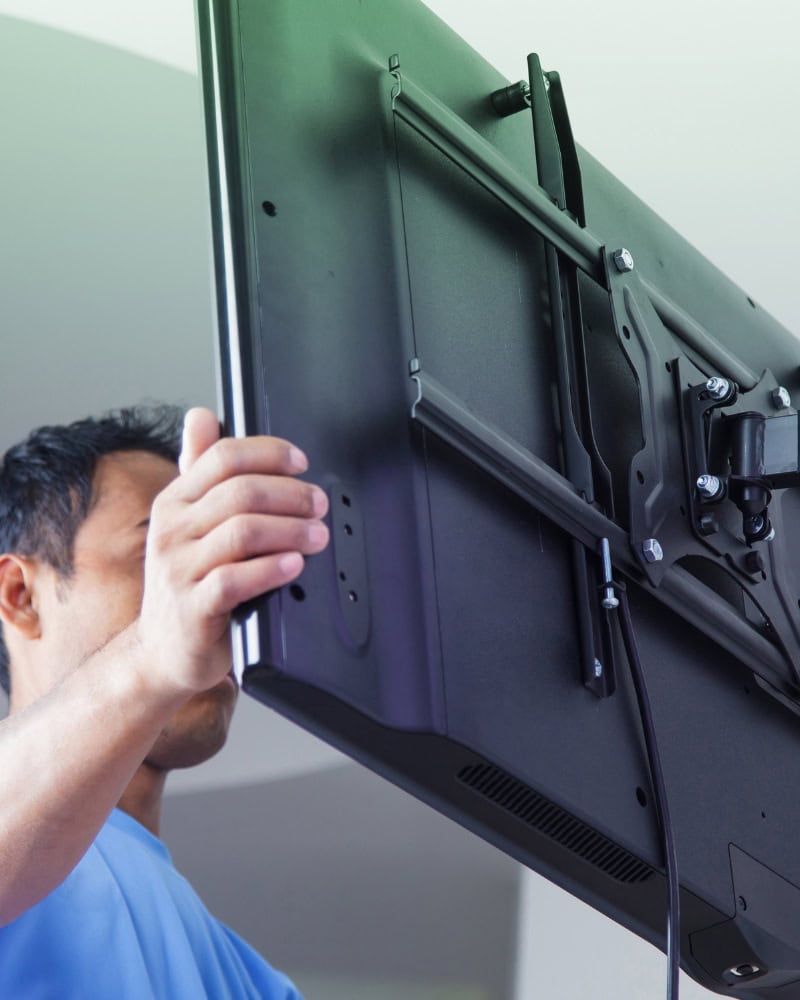 Adjusting TV on the wall